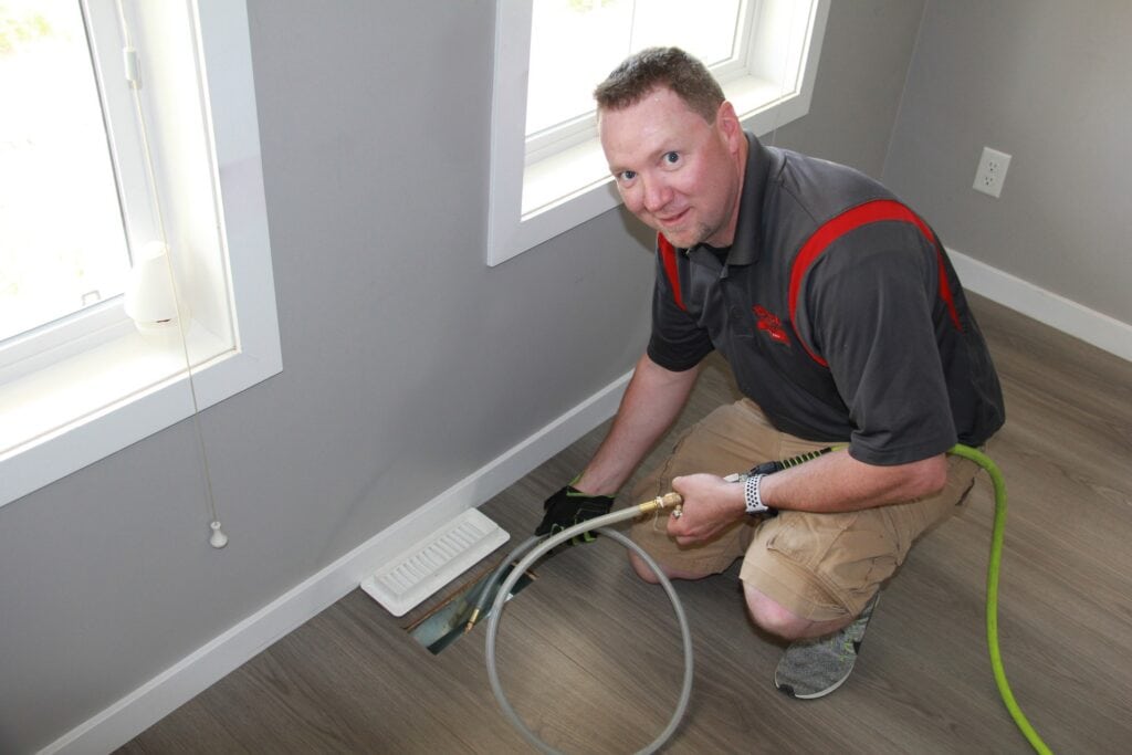 man cleaning ducts